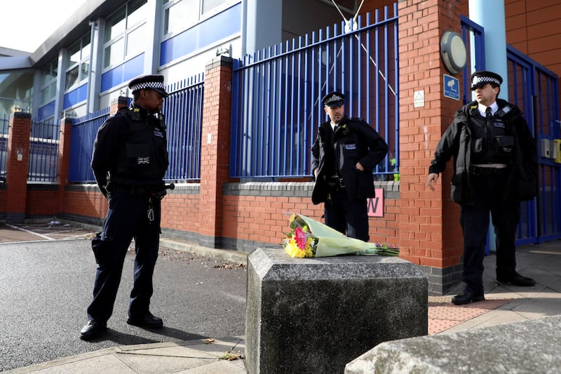 LONDON, ENGLAND - SEPTEMBER 25: Flowers are left at Croydon Custody Centre after a police officer was shot dead on September 25, 2020 in the Croydon area of London, England. A murder investigation has been launched following the death of a police officer at the Croydon Custody Centre in south London. He was shot by a 23-year-old man who was also treated for a gunshot wound. The officer died later in hospital. The death will be investigated by the  Independent Office for Police Conduct. (Photo by Dan Kitwood/Getty Images)