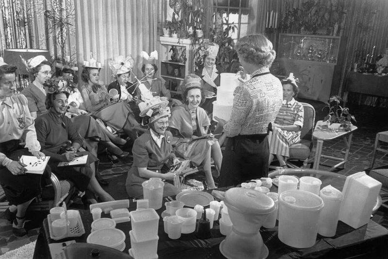 Circa 1950: A Tupperware party underway in someone’s living room. Hulton Archive / Getty Images
