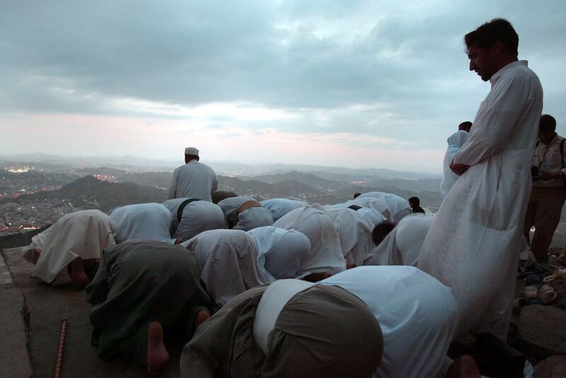 Pilgrims pray at the top of Jabal Al Nour in January 2004. Although climbing the mountain is not part of the pilgrimage, many Muslims make their way to the summit each year.