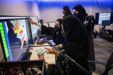 Interns at Lockheed Martin’s Centre for Innovation and Security Solutions in Masdar City, Abu Dhabi, test their algorithm to detect paint and primer defects on jet airframes. Lockheed Martin 