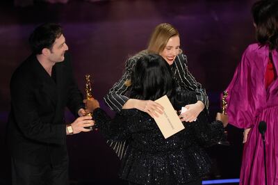 Octavia Spencer, centre, presents the award to Arthur Harari, from left, and Justine Triet. AP  / Chris Pizzello
