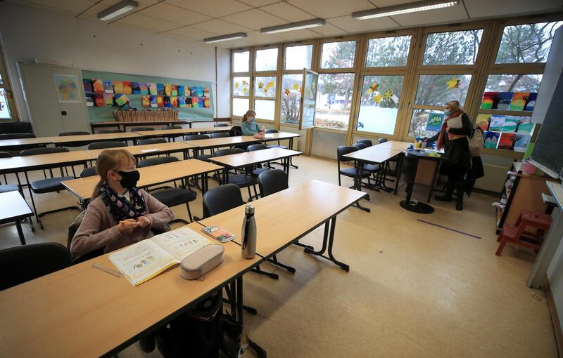 A teacher conducts a lesson for just two pupils in Bonn, Germany. Reuters