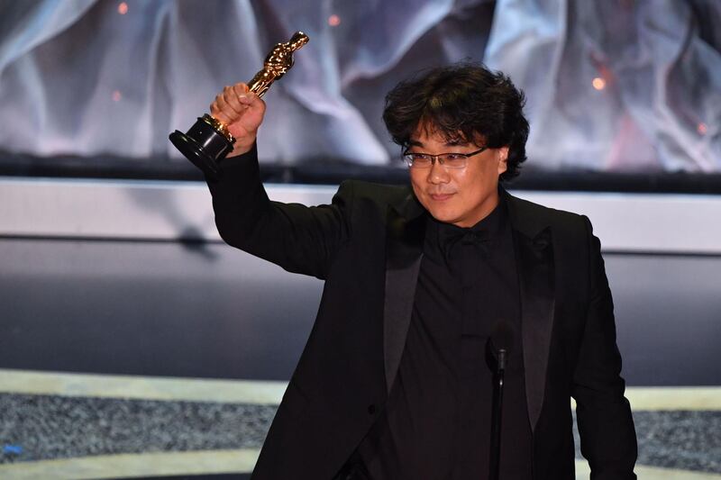 South Korean director Bong Joon-ho accepts the award for Best International Feature Film for 'Parasite' at the 92nd Academy Awards on Sunday, February 9. AFP