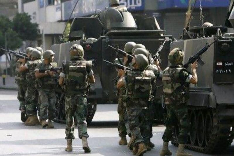 Lebanese soldiers patrol the Corniche Al Mazraa neighbourhood of Beirut. The army says it is determined to restore order in Lebanon, which is roiled by growing political tensions linked to Syria.