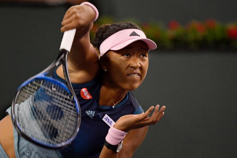 Naomi Osaka serves to Kristina Mladenovic. AP Photo