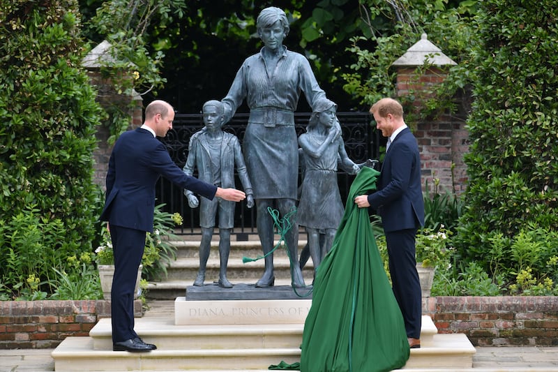 Prince William and Prince Harry unveil a statue they commissioned of their mother, at Kensington Palace in 2021, on what would have been her 60th birthday. PA