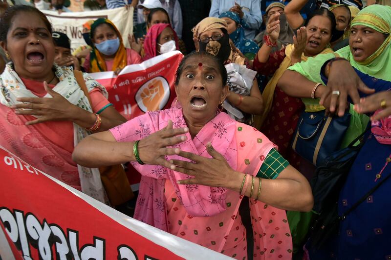 Protesters take part in the general strike against the policies of the central government, in Ahmedabad. AFP