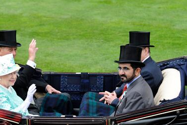 Queen Elizabeth II and her husband the Duke of Edinburgh sit opposite Sheikh Mohammed bin Rashid, Ruler of Dubai and head of Godolphin racing stable, as they arrive at the course in 2009. AFP             2009 - Queen Elizabeth II and her husband the Duke of Edinburgh sit opposite Sheikh Mohammed bin Rashid, Ruler of Dubai and head of Godolphin racing stable. AFP                           AFP)