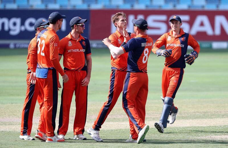 DUBAI, UNITED ARAB EMIRATES , October 29  – 2019 :- Fred Klaassen of Netherlands ( center ) celebrating after taking the wicket of Rohan Mustafa during the World Cup T20 Qualifier between UAE vs Netherlands held at Dubai International Cricket Stadium in Dubai.  ( Pawan Singh / The National )  For Sports. Story by Paul