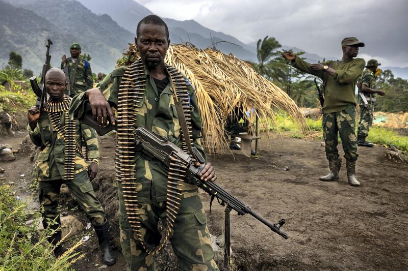 MWENDA SURROUNDS, NORTH KIVU, DEMOCRATIC REPUBLIC OF THE CONGO - APRIL 07:  Soldiers from the Congolese Army Forces are seen in their forward operating bases around Mwenda, a small town that sits at the foot of the Rwenzori mountains, on April 7, 2021 in North Kivu, Democratic Republic of the Congo. It is close to Virunga National Park where a camp of ADF members live and hide. This town has been attacked multiple times by the ADF, with many civilians killed and some beheaded. A number of people including children have been abducted. As a result the Congolese army has a number of forward operating bases dotted around the area. The ADF is an Islamic terror group based out of Eastern DR Congo that, in recent years, has developed a relationship with the Islamic State after pledging allegiance to ISIS leadership. They are known locally as ISIS in Congo. ADF have killed over 5000 Congolese civilians in recent years, abducted and displaced thousands and killed over 2500 Congolese Army Soldiers. (Photo by Brent Stirton/Getty Images)