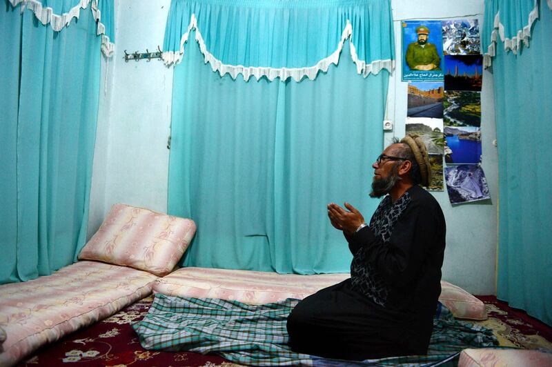 Former Soviet soldier Bakhretdin Khakimov prays in his home in Herat in 2015. AFP