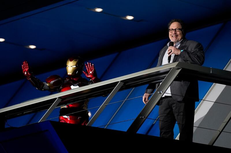 Actor and director Jon Favreau speaks as an Iron Man character looks on at the Avengers Campus dedication ceremony at Disney's California Adventure Park on June 2, 2021. AP