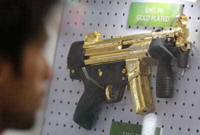 A gold-plated SMG PK is displayed at the Pakistani stand during the last day of the Egypt Defense Expo, showcasing military systems and hardware, in Cairo, Egypt, December 5, 2018. REUTERS/Mohamed Abd El Ghany