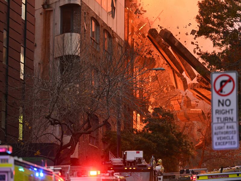 A wall collapses after a fire broke out in the Central Business District of Sydney. EPA