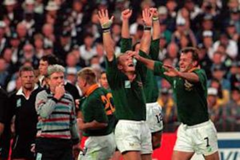 Francois Pienaar, centre, celebrates South Africa's World Cup win in 1995.