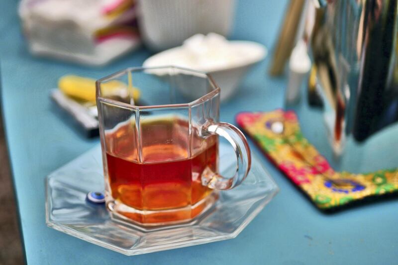 Pictured: Tea is served in a pretty glass with a Turkish evil eye placed on the saucer. Owner Laila Haidari opened the restaurant 10 years ago with the intention of supporting herself and a rehabilitation clinic for drug addicts.
Photo by Charlie Faulkner