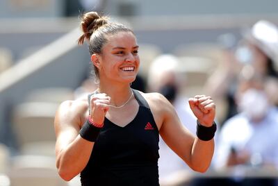 epa09257388 Maria Sakkari of Greece celebrates after winning her quarter final match against Iga Swiatek of Poland at the French Open tennis tournament at Roland Garros in Paris, France, 09 June 2021.  EPA/IAN LANGSDON