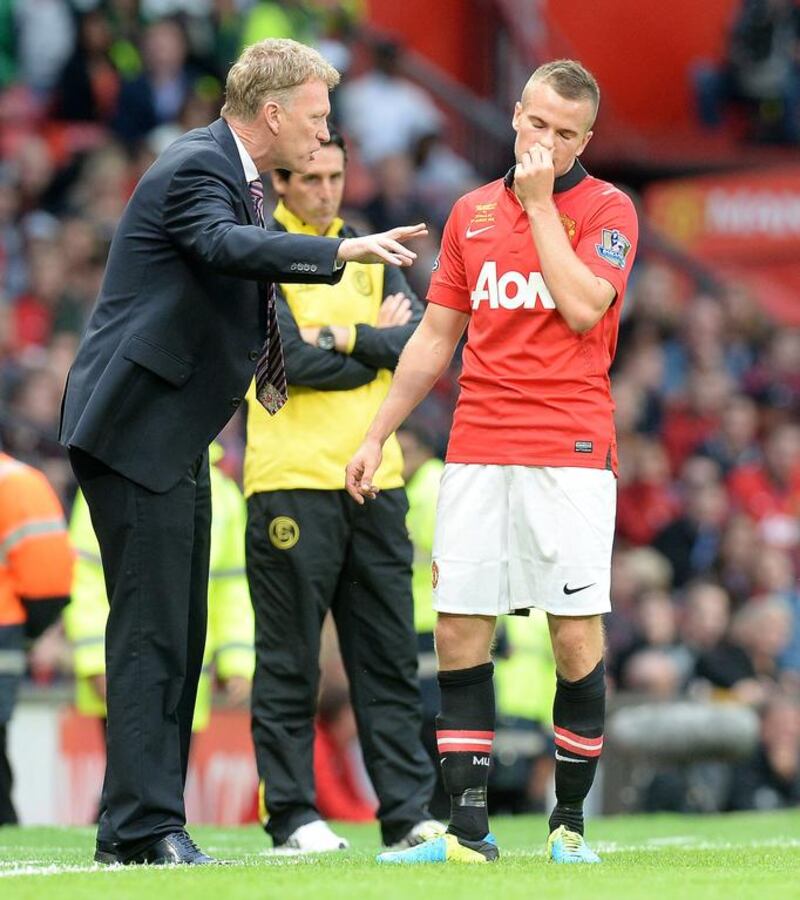 Manchester United manager David Moyes, left, and Tom Cleverley. PA Wire