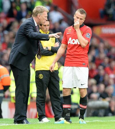 Tom Cleverley receives instructions from then Manchester United manager David Moyes during the 2013/14 season. PA