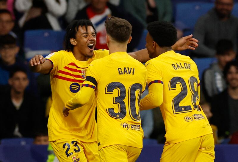 Barcelona's Jules Kounde celebrates scoring their fourth goal with Gavi and Alex Balde. Reuters