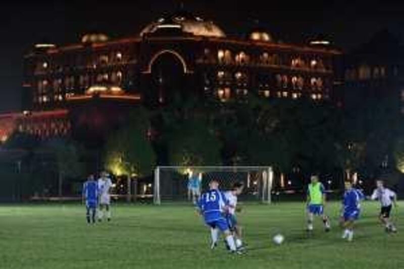 Abu Dhabi - October 15, 2008 - The Emirates Palace is the backdrop for the football match between the Abu Dhabi Strollers and Emirates Palace in Abu Dhabi, October 15, 2008. ( Jeff Topping / The National) *** Local Caption ***  JT005-1015-EXPAT FOOTBALL 7F8Q3755.jpgJT005-1015-EXPAT FOOTBALL 7F8Q3755.jpg