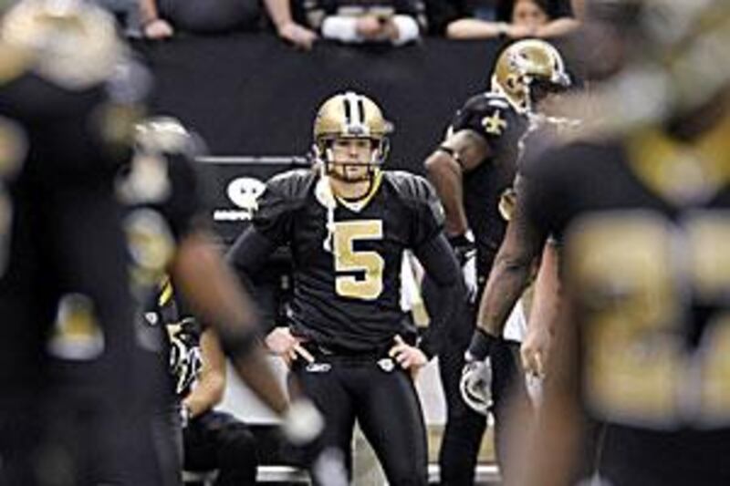 The Saints' Garrett Hartley, whose field goal beat the Vikings, watches game action from the sidelines.