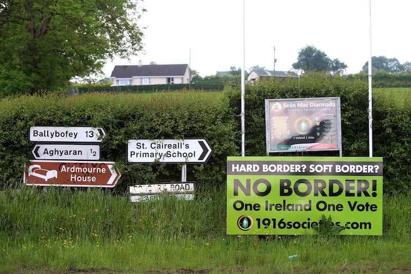 epa06779403 An Anti Brexit sign is seen beside traffic signs on the Corgary Road near Castlederg, Northern Ireland, 01 June 2018. Northern Ireland could be given joint EU and UK status and a 'buffer zone' on its border with the Republic, under new plans being drawn up by David Davis, according to reports.  EPA/PAUL MCERLANE