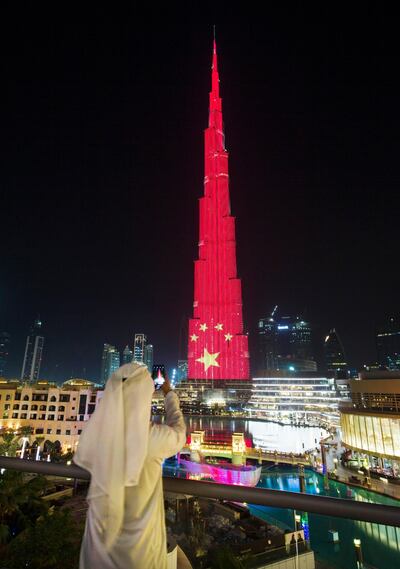 DUBAI, UNITED ARAB EMIRATES, 17 JULY 2018 -Burj Khalifa lighting up in Chinese flag to mark Chinese president’s visit to the UAE this week.  Leslie Pableo for The National