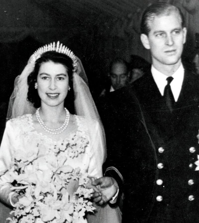 Queen Elizabeth II, as Princess Elizabeth, and her husband the Duke of Edinburgh, styled Prince Philip in 1957, on their wedding day. She became queen on her father King George VI's death in 1952.   (Photo by Hulton Archive/Getty Images)