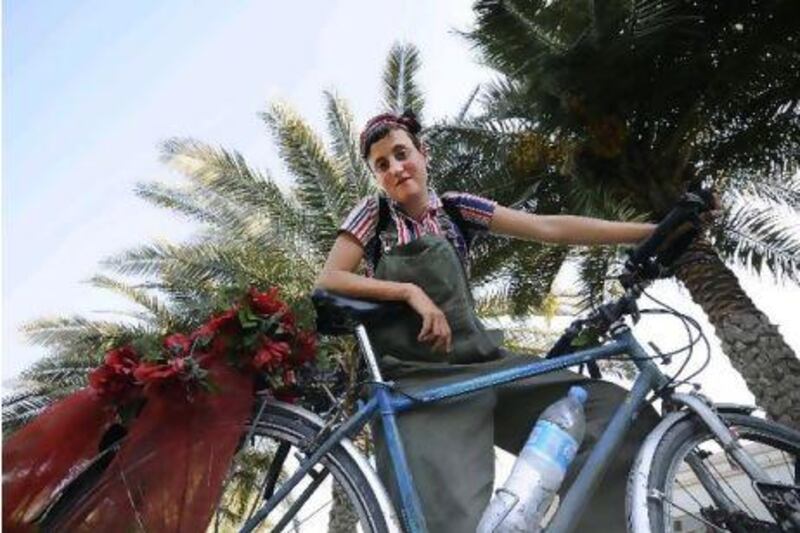 Tilly Gillford, who is cycling her way to India from the UK, rests in Dubai on Friday. Charles Crowell for The National