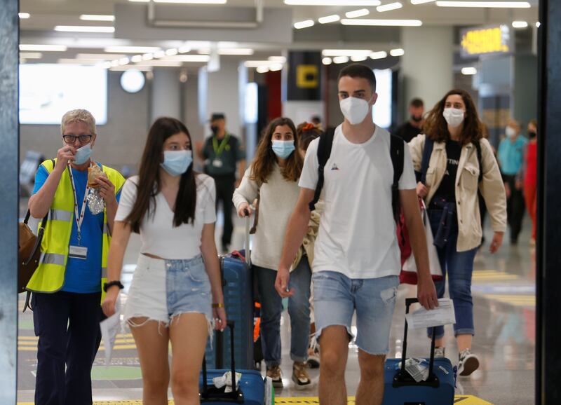 Tourists from Britain arrive at Palma de Mallorca Airport, Spain.