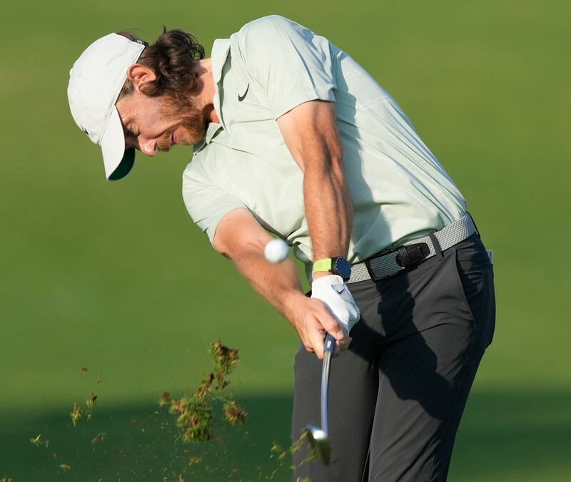 Tommy Fleetwood of England plays a shot on the 14th fairway. AP