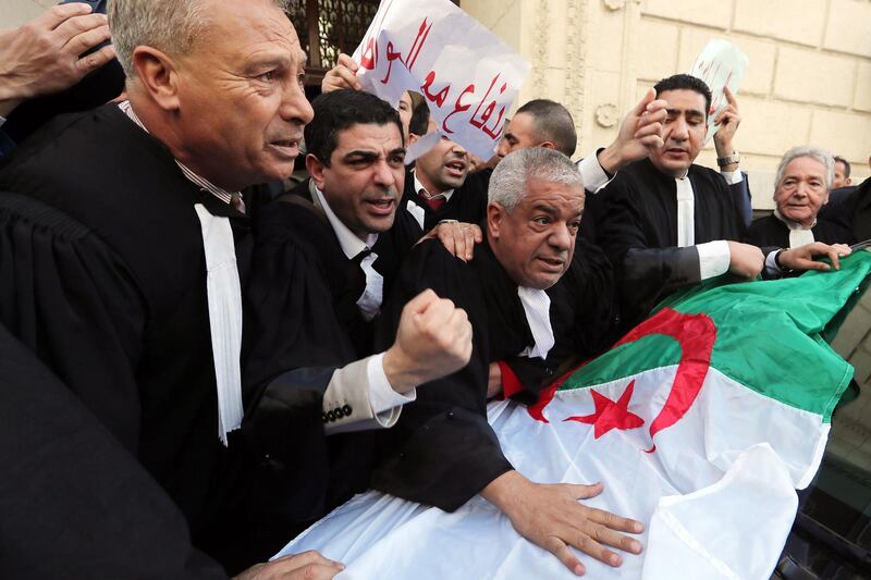 epa07396428 Algerian lawyers chant slogans during a protest against the fifth term of Abdelaziz Bouteflika in Algiers, Algeria, 25 February 2019. Abdelaziz Bouteflika, serving as the president since 1999, has announced on 19 February he will be running for a fifth term in presidential elections scheduled for 18 April 2019.  EPA/MOHAMED MESSARA