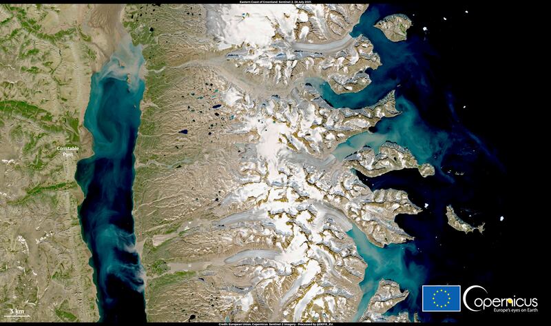 The satelite image shows very significant discharge of sediment into the Arctic Ocean by glaciers melting around Greenland's Constable Pynt, caused by unusually high temperatures. European Union Copernicus/ Reuters