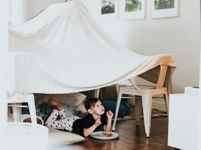 A den-building contest will keep little ones occupied for hours. Photo: Nathan Dumlao / Unsplash