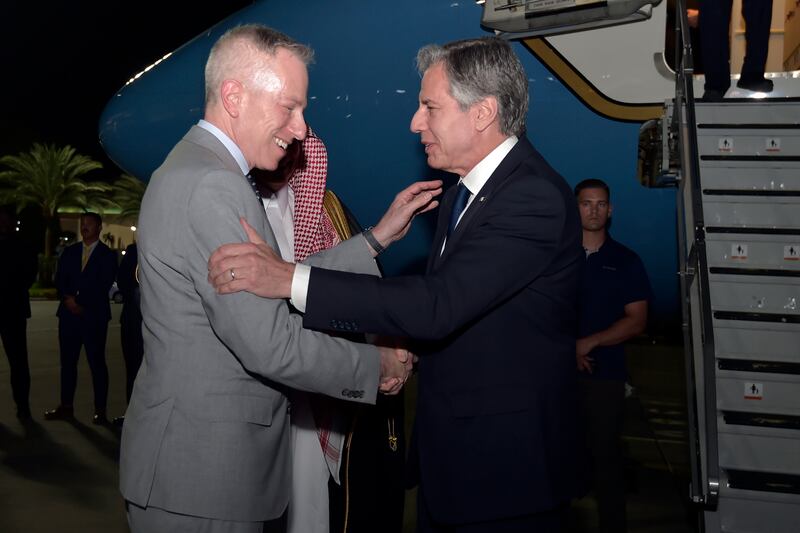 American ambassador to Saudi Arabia Michael Ratney greets the US Secretary of State on his arrival in Jeddah. AP