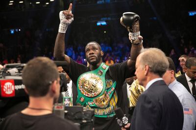 Deontay Wilder celebrates after knocking out Bermane Stiverne in the first round of the WBC heavyweight title boxing bout Saturday, Nov. 4, 2017, in New York. (AP Photo/Kevin Hagen)
