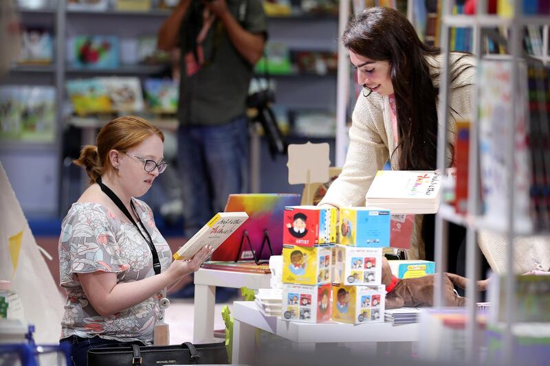 ABU DHABI,  UNITED ARAB EMIRATES , April 24 – 2019 :- Visitors browsing books at the Abu Dhabi International Book Fair held at Abu Dhabi National Exhibition Centre in Abu Dhabi. ( Pawan Singh / The National ) For News/Online/Instagram. Story by Rupert