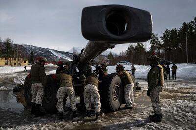 Finnish soldiers operate a field gun during exercises in the far north of Europe. AFP 