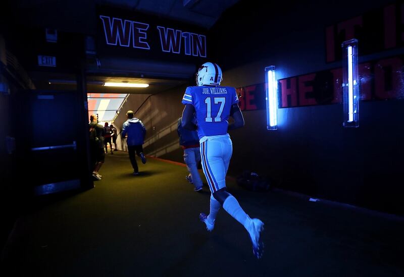 Jordon Williams of the Southern Methodist Mustangs runs through the tunnel before a game against the TCU Horned Frogs at Gerald J. Ford Stadium in Dallas, Texas.  Getty