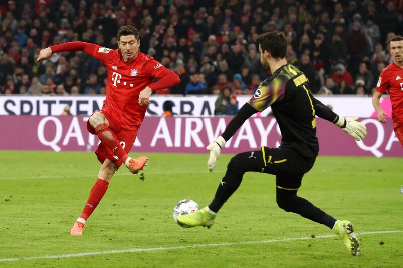 Robert Lewandowski scores Bayern's third goal against Dortmund. Getty Images