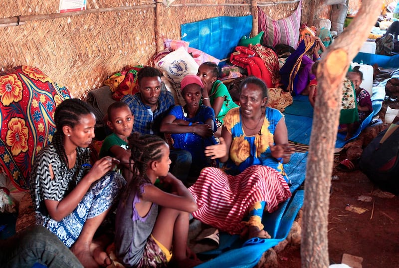 Ethiopian refugees who fled fighting in Tigray province lay in a hut at the Um Rakuba camp in Sudan's eastern Gedaref province. AFP