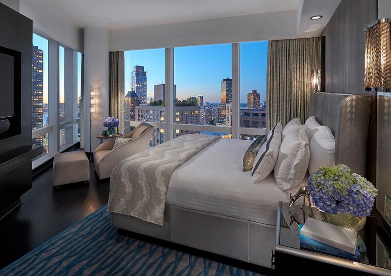 <p>A bedroom in a Hudson-view suite at Mandarin Oriental, New York</p>
