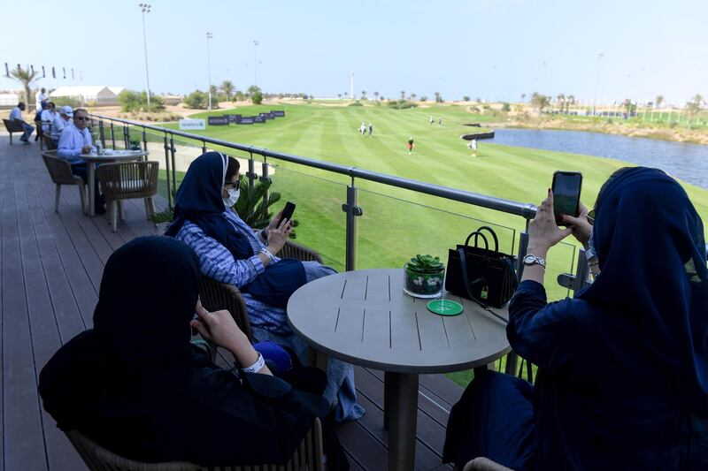 Saudi women watch golfers compete in the Saudi Ladies International. AFP