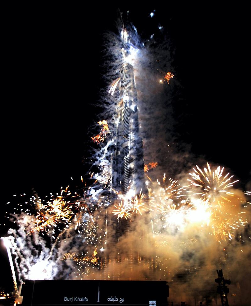 Dubai's Burj Khalifa tower, the world's tallest skyscraper, is lit by fireworks during its opening ceremony in the Gulf emirate on January 4, 2010. Sheikh Mohammad bin Rashed al-Maktoum, the ruler of Dubai, officially opened the world's tallest building, which stands at 828 metres high. AFP PHOTO/KARIM SAHIB (Photo by KARIM SAHIB / AFP)