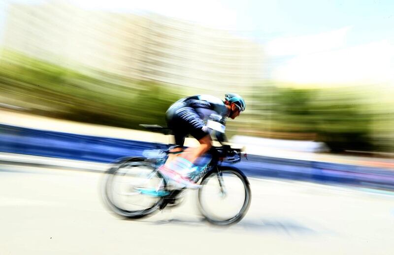 A cyclist from Omega Pharma-Quick Step sprints during the individual time race stage of Dubai Tour on Wednesday. Marwan Naamani / AFP 