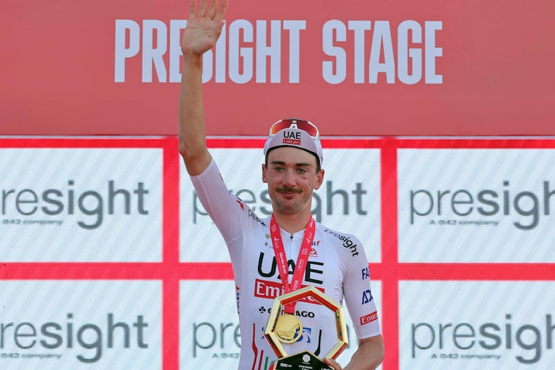 UAE Team Emirates' US cyclist Brandon McNulty after winning the Stage 2 time trial in the UAE Tour 2024 on Al Hudayriyat Island in Abu Dhabi on February 20, 2024 AFP)