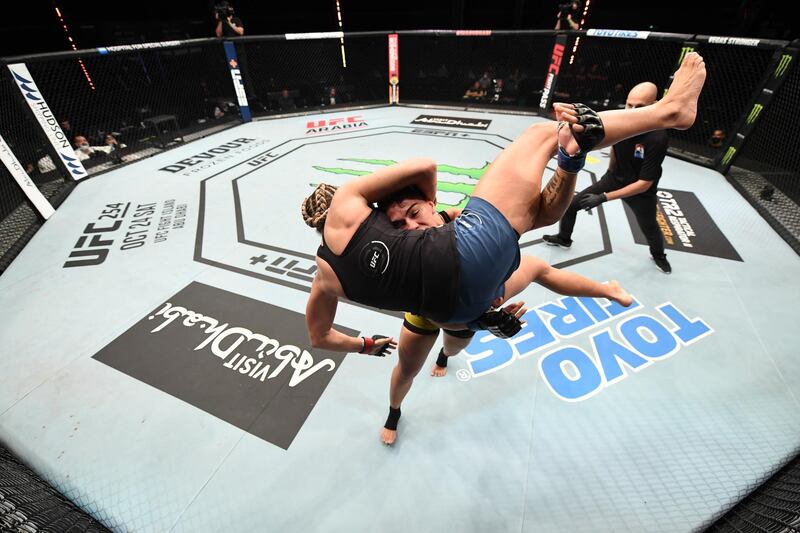 Brazilian Jessica Andrade of Brazil takes down Katlyn Chookagian of the US in their women's flyweight bout at UFC Fight Night on Yas Island in Abu Dhabi on Sunday, October 18. Getty