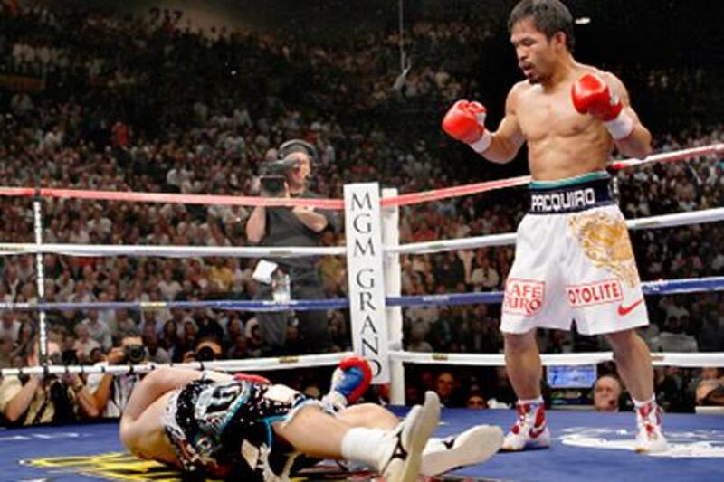 Ricky Hatton is knocked down by Manny Pacquiao in their title bout at the MGM Grand Gaden Arena, Las Vegas, in May 2009.