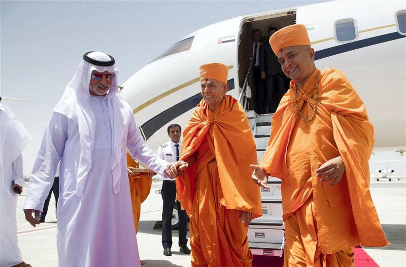 Sheikh Nahyan Mabarak Al Nahyan leads Swamishri towards the airport terminal. courtesy: BAPS